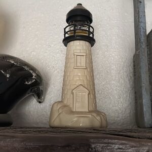 Ceramic Lighthouse Avon bottle and fish Avon bottle together